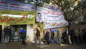 Egypt elections: Egyptian voters queue at a polling station in the Manial neighbourhood 