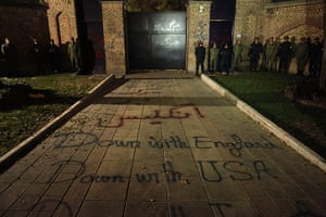 British Embassy, Iran: Iranian policemen stand guard outside the Gholhak compound