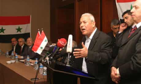 Syrian academic Burhan Ghalioun gives his address during a meeting in Istanbul