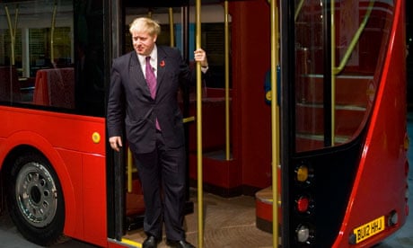 Boris Johnson stands on the platform of the new bus for London