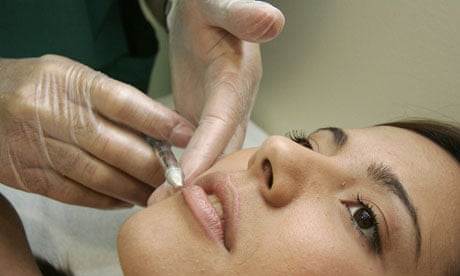 A woman receiving a treatment at a cosmetic surgery practice
