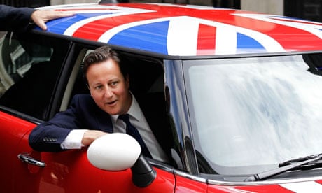 David Cameron in a Mini Cooper decorated with the union flag