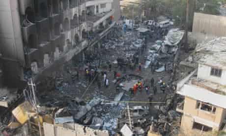 Iraqi security forces at the scene of the car bomb attack in Baghdad