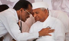 Anna Hazare is examined by a doctor before beginning his three-day hunger strike