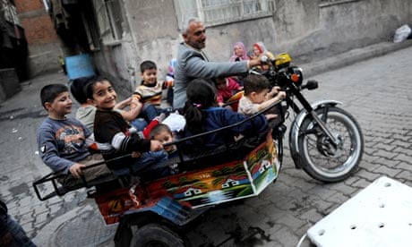 Kurdish children being driven around by motorbike in Diyarbakir
