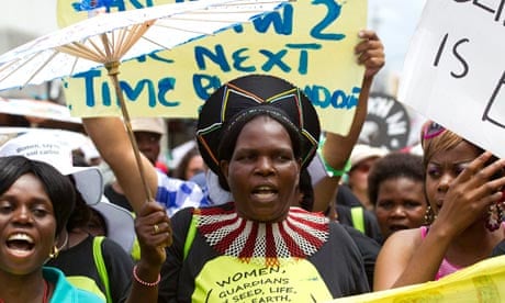 Environmental activists demonstrate outside the UN climate talks in Durban