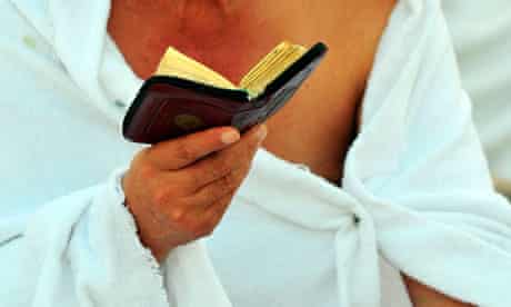 A pilgrim reads the Qur'an