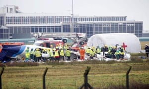 Emergency crews at the scene of the Manx2 commuter plane crash at Cork Airport, Ireland