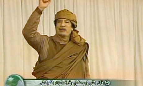 Libyan leader Muammar Gaddafi gestures during a rally on 19 February 2011