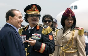 Muammar Gaddafi : June 2009: Gaddafi and Italy's PM Berlusconi leave Ciampino Airport in Rome