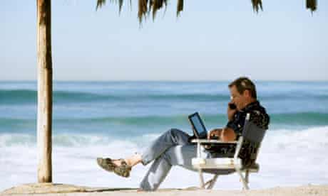 Using Cell Phone and Laptop on Tropical Beach