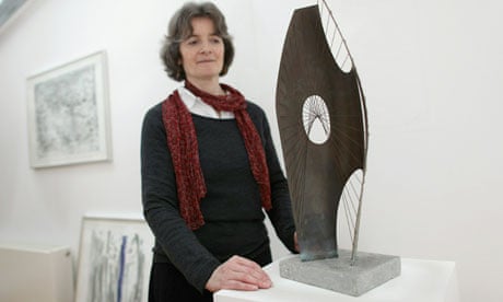 Barbara Hepworth's granddaughter Sophie Bowness with a maquette of Hepworth's Winged Figure 1957