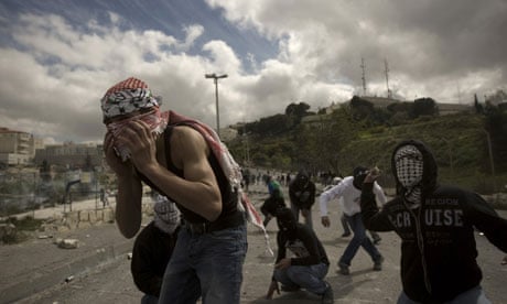 Palestinian youths throw stones in East Jerusalem, 2010