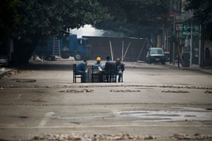 Egypt day 14 update: Anti-government protesters sit in the middle of an empty street