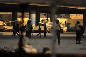 Egypt protests day 16: Egyptian soldiers watch people on the outskirts of Cairo's Tahrir square 