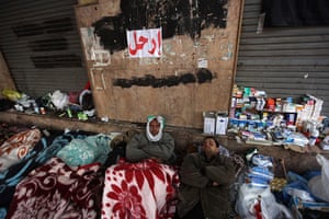 Egypt protests day 16: Aanti-government protesters sleep in a makeshift clinic in Tahrir Square