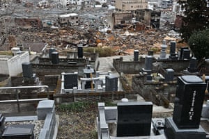 Japan aftermath: The devasted town of Otsuchi in Iwate prefecture behind tombstones