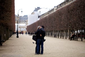 New Europe, France: A couple embrace in the Jardin du Palais Royal, Paris, France