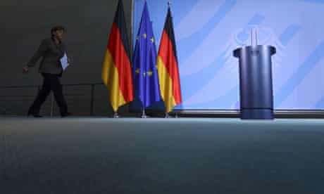 Angela Merkel arrives for a press conference in Berlin