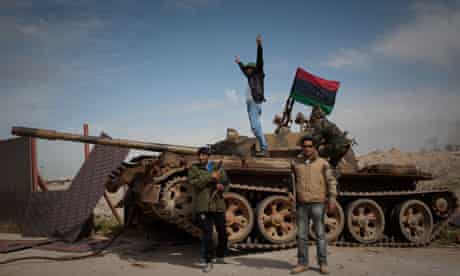 Libyan rebels with a government tank