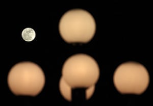 Super moon: The moon behind street lamps in Lausanne, Switzerland