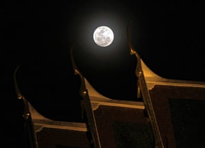 Super moon: A full perigee moon rises over the Grand Palace in Bangkok, Thailand
