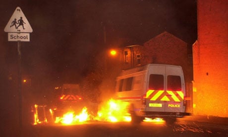 oldham riots police van drives through flames