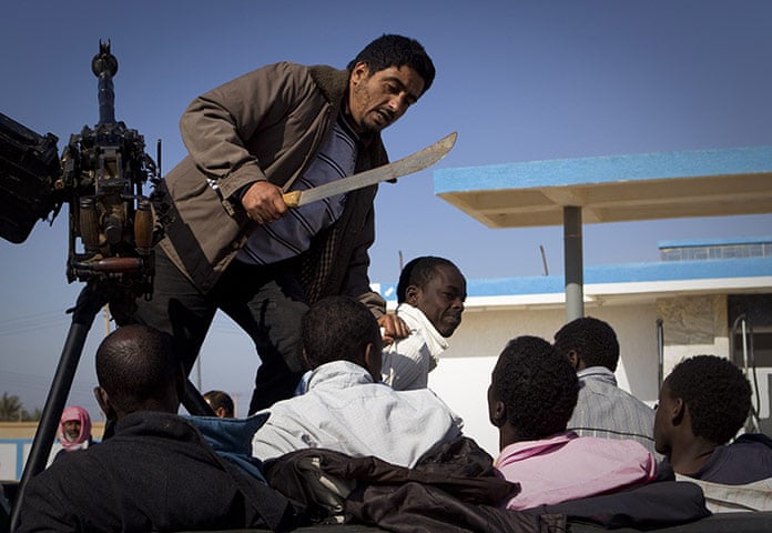 Vente des esclaves Africains en Lybie A-Libyan-rebel-with-a-mac-006