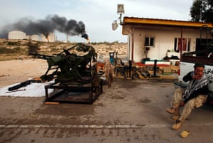 Eastern Libya: A rebel sits inside an oil terminal compound in Zueitina