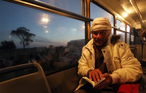 Refugees Flee Libya: An Egyptian resident in Libya on a bus after fleeing the unrest in Libya