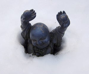 In pictures: rebirth: Buddha statue in snow