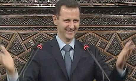 Video grab of Syrian president Bashar al-Assad acknowledging applause before addressing parliament