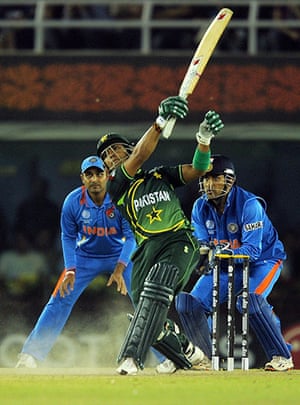 India v Pakistan: Pakistan batsman Umar Akmal hits a six