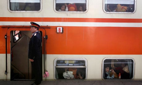 Railway officer beside a train, China