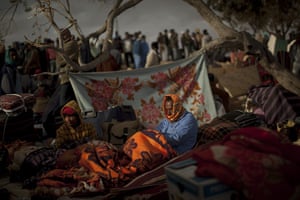 24 hours in pictures: Ras Ajdir, Tunisia: Men from Bangladesh wake up in a refugee camp