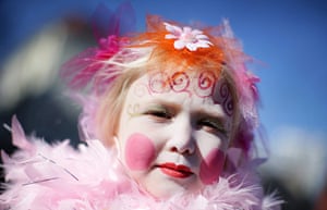 24 hours in pictures: Cologne, Germany: Young Elea takes part in a carnival 