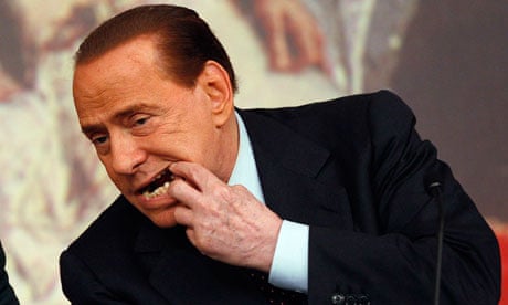Italian prime minister, Silvio Berlusconi, shows damage to his teeth for which he has had surgery