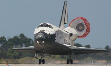 The space shuttle Discovery lands at Kennedy Space Centre