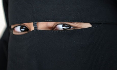 A Muslim woman in a niqab.