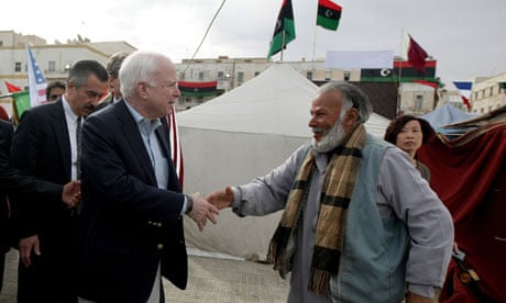 John McCain meets a Libyan rebel in Benghazi