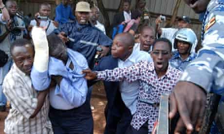 Ugandan opposition leader Kizza Besigye is arrested by police in Kampala