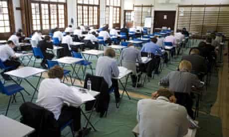 GCSE-age schoolchildren sitting an exam in a school hall at Maidstone grammar school, Norfolk