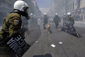 Protests in Athens: Greek riot police arrest a demonstrator during a protest in Athens 
