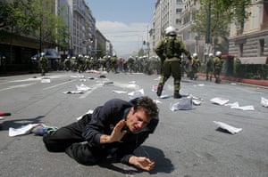 Protests in Athens: A protester falls to the ground during clashes with police