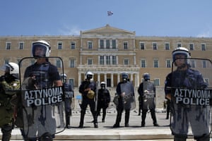 Protests in Athens: Riot police stand outside the Greek parliament