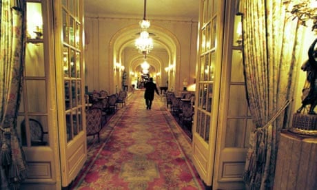 A waiter carries a tray at the Ritz
