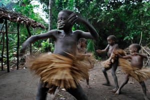 Disappearing world: Mbuti boys wear grass skirts during their nkumbi circumcision ceremony.