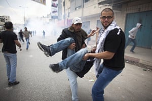 Israel violence: Tear gas during clashes with the Israeli police at Qalandiya checkpoint
