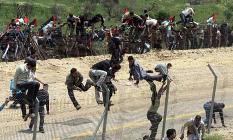 Protesters climb the fence between Syria and Israel 