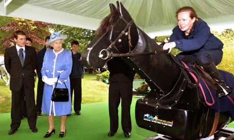 Queen Elizabeth II and Jonny Murtagh watch a demonstration at the Irish National Stud